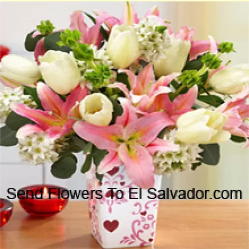 Pink Lilies And White Tulips With Assorted White Fillers In A Glass Vase - Please Note That In Case Of Non-Availability Of Certain Seasonal Flowers The Same Will Be Substituted With Other Flowers Of Same Value