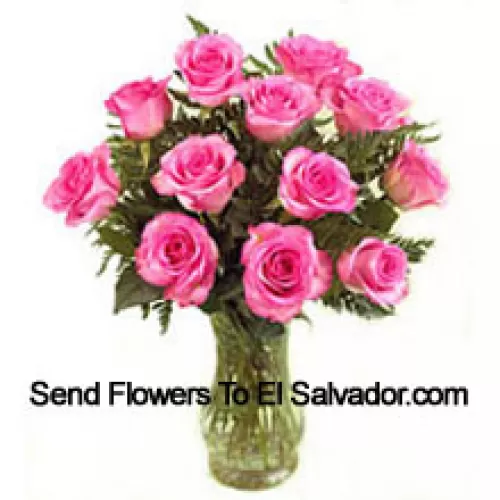 12 Pink Roses With Some Ferns In A Vase