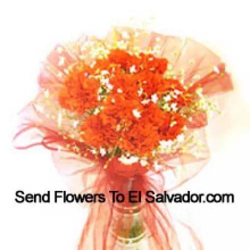 12 Orange Carnations With Some Ferns In A Vase