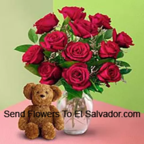 12 Red Roses With Some Ferns In A Vase And A Cute Brown 8 Inches Teddy Bear